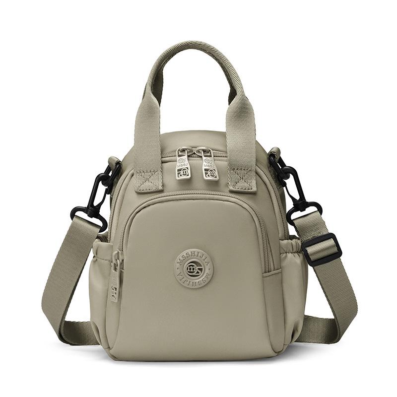 Kompakt Nylon Crossbody Miniryggsäck med Topphandtag Casual Liten Dagryggsäcksväska för Kvinnor Daglig Resa