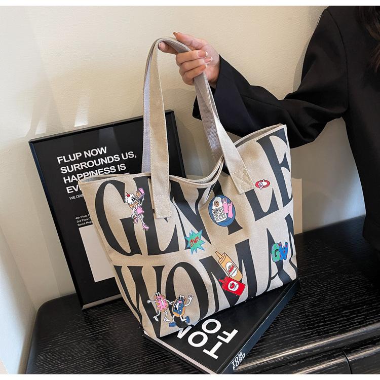 Canvas bag Women's large-capacity printed alphabet portable shoulder commuter tote bag Fashion new