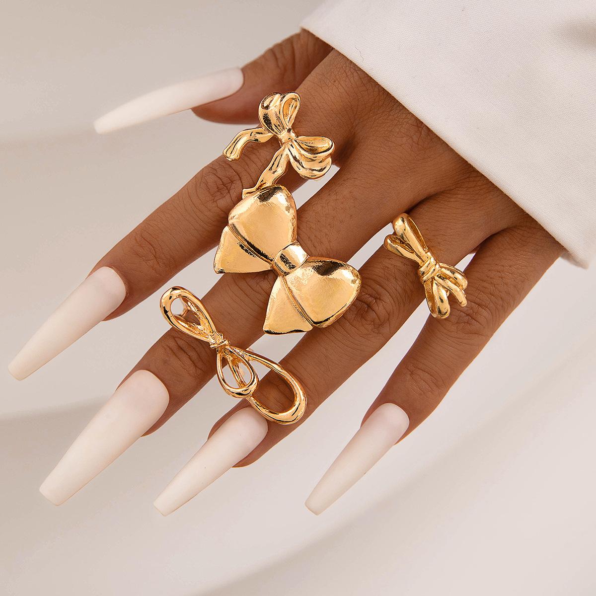 

European and American fashion love hollow dripping oil ring niche butterfly combined with gold stacked ring ring set for women