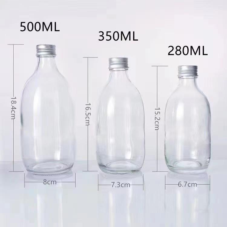 Transparent Round Glass Bottles with Lids for Juice, Milk, Tea, Cold Brew, and Coffee.