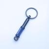 In-Stock Black Shock Absorber Keychain: Pressable Metal Spring Accessory - Perfect Small Gift