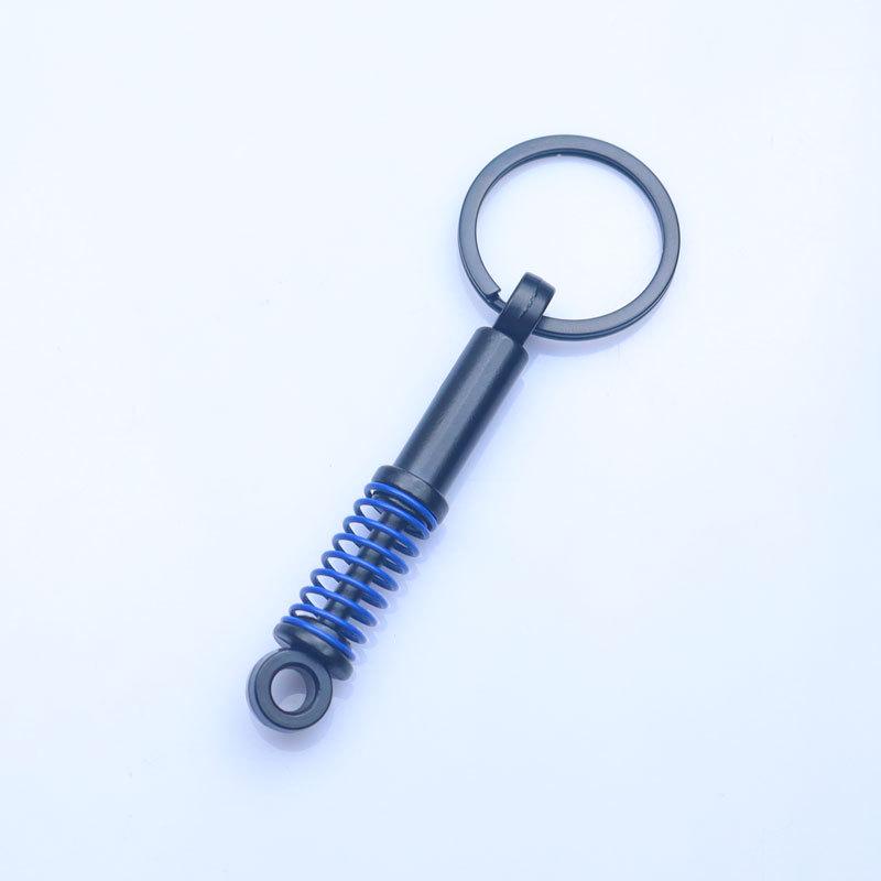 In-Stock Black Shock Absorber Keychain: Pressable Metal Spring Accessory - Perfect Small Gift