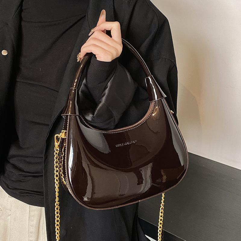 New fashion high-end texture patent leather portable crescent bag temperament light luxury versatile commuter messenger women's bag