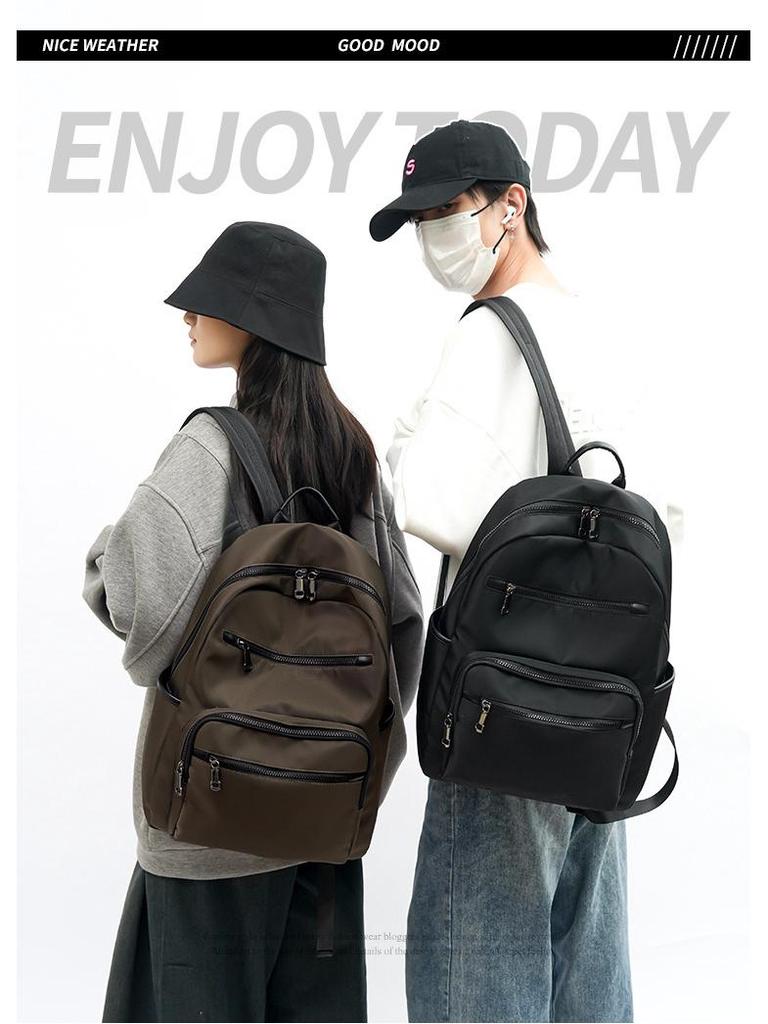 High-End Casual Waterproof Nylon Backpack: Fashionable, Lightweight Travel Bag for Men & Women, with Shoulder Straps & Laptop Compartment.