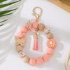 Silicone Beaded Keychain with Daisy, Wooden Butterfly Bracelet & Tassel Pendant