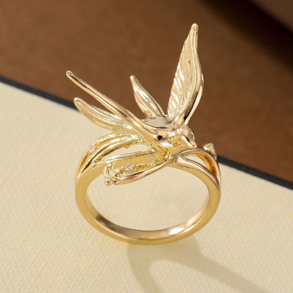 Elegant swallow-shaped copper ring with tiny inlaid artificial gems for women, suitable for dating and daily matching.