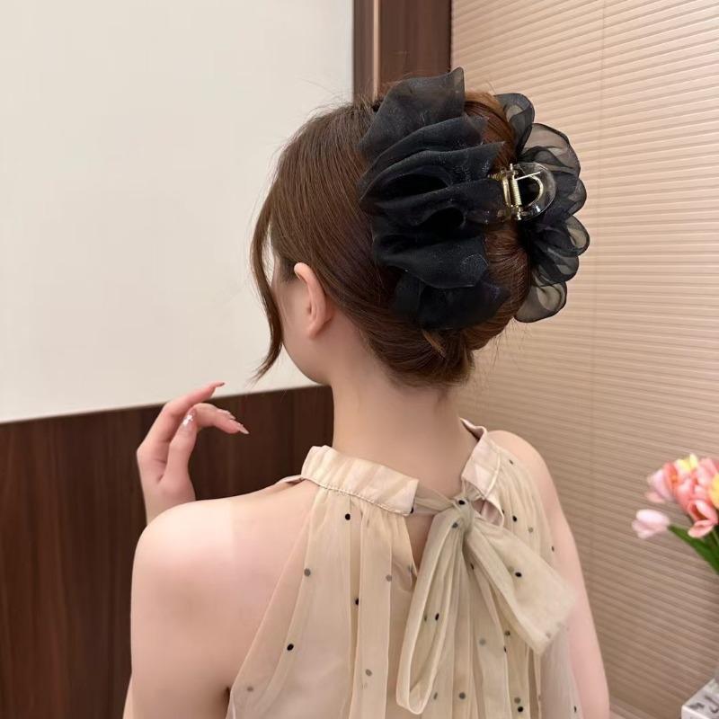 The Mesh Grabber Is Elegant and Feminine with A Lot of Hair On The Back of The Head. It Is A Shark Clip Hair Accessory