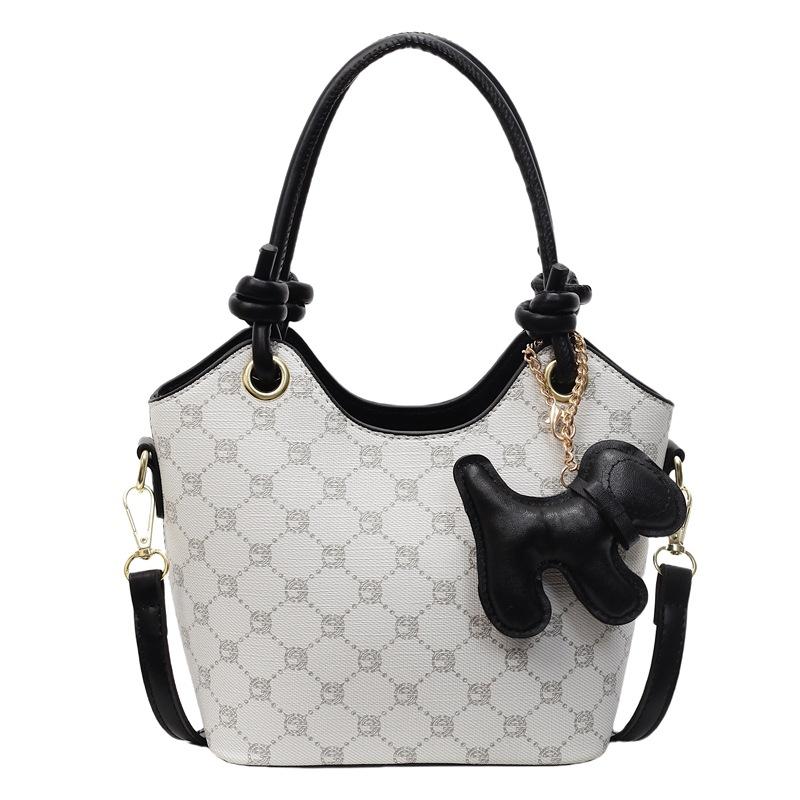 Korean version of trend, high-end printing temperament, portable bucket bag, niche fashion commuting versatile light luxury messenger bag, women