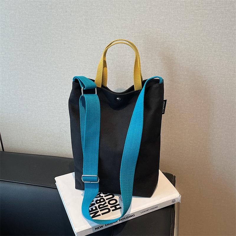 Portable shoulder tote cloth bag women's new simple commuting design sense niche large-capacity leisure bucket bag