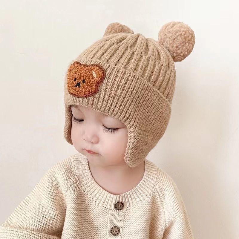 Kinderhüte Herbst und Winter Jungen niedlich super niedlich gestrickte Wollmütze Mädchen winddichte Ohrenschützer Baby verdickte warme Mütze