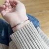 Braccialetto Filo Rosso Koi per Donna, Squisito Stile 2025: Design Intrecciato Cinese Antico e Moderno