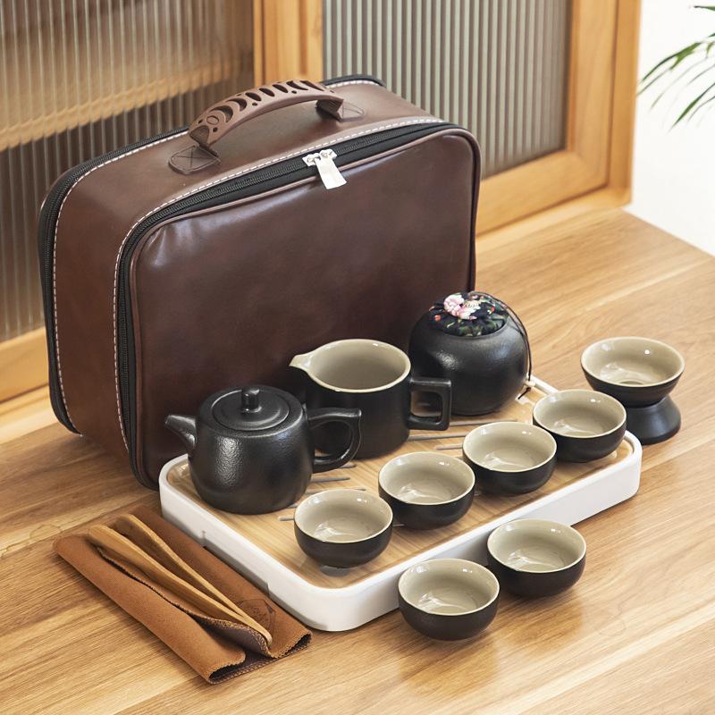 Black pottery travel kung fu tea set portable business gift set creative ceramic cooling pot set