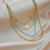 Gold Multi-layer Turquoise Beaded Necklace with Sun Charm Pendant