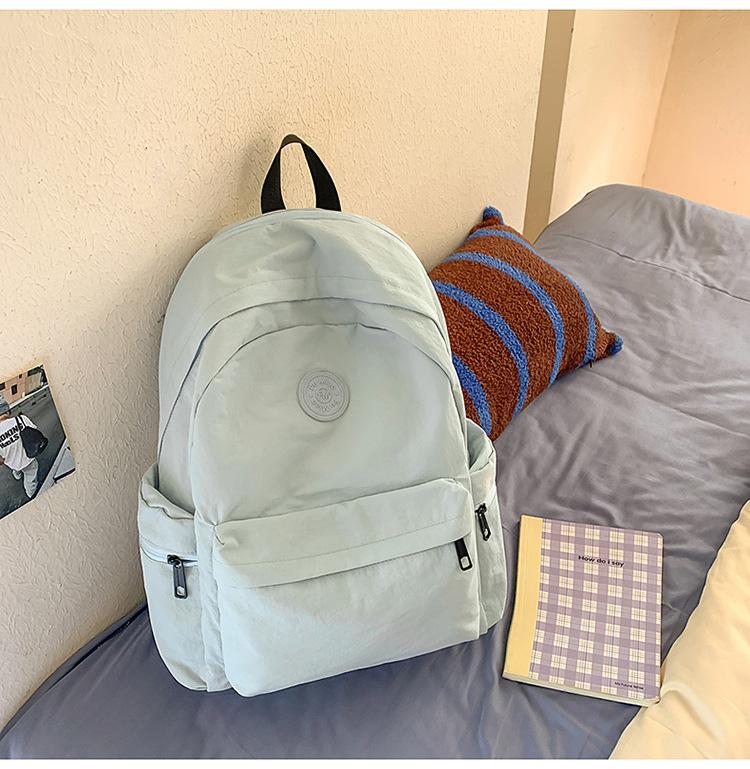 School bag Japanese simple solid color backpack light commuting large capacity student school bag casual versatile outdoor travel backpack