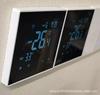 Smart WIFI touch screen thermostat with three-speed fan coil control for central air conditioning remote management.