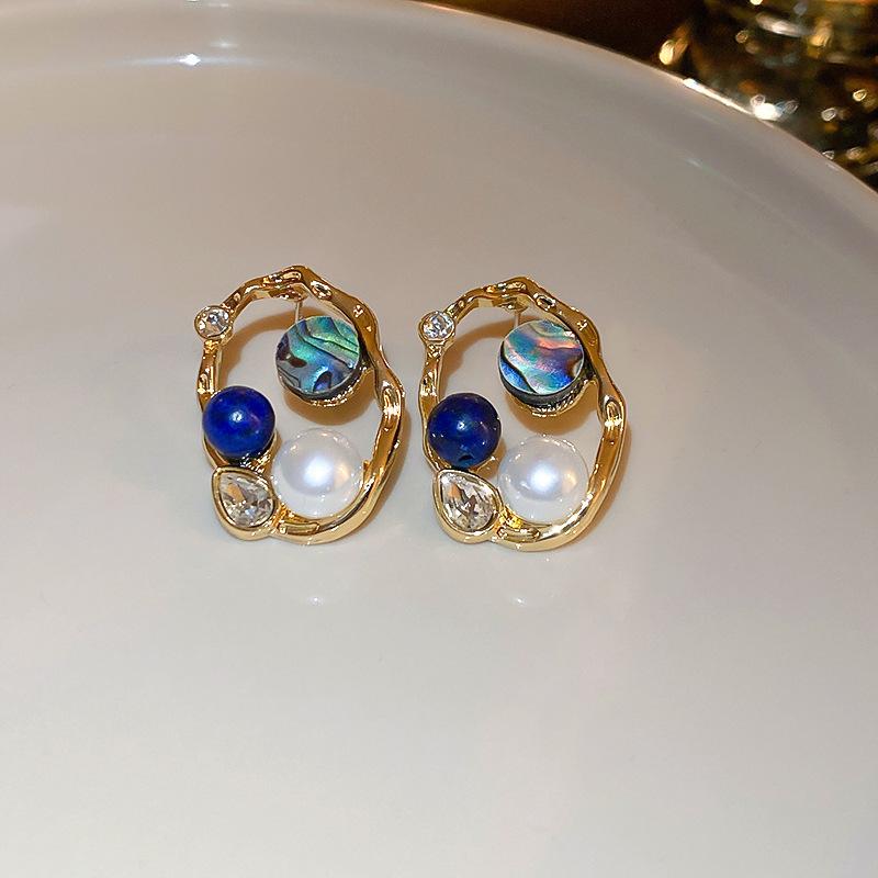 European and American metal wind hollow flower fishtail pearl earrings exaggerated temperament earrings heavy industry earrings