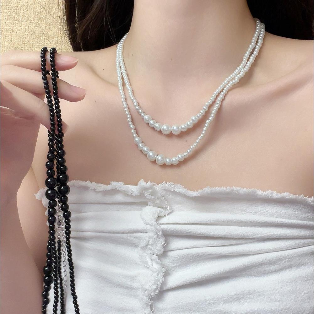 Irregular multi-layer stacking wearing long pearl necklace French light luxury temperament sweater chain simple high-end neck chain tide