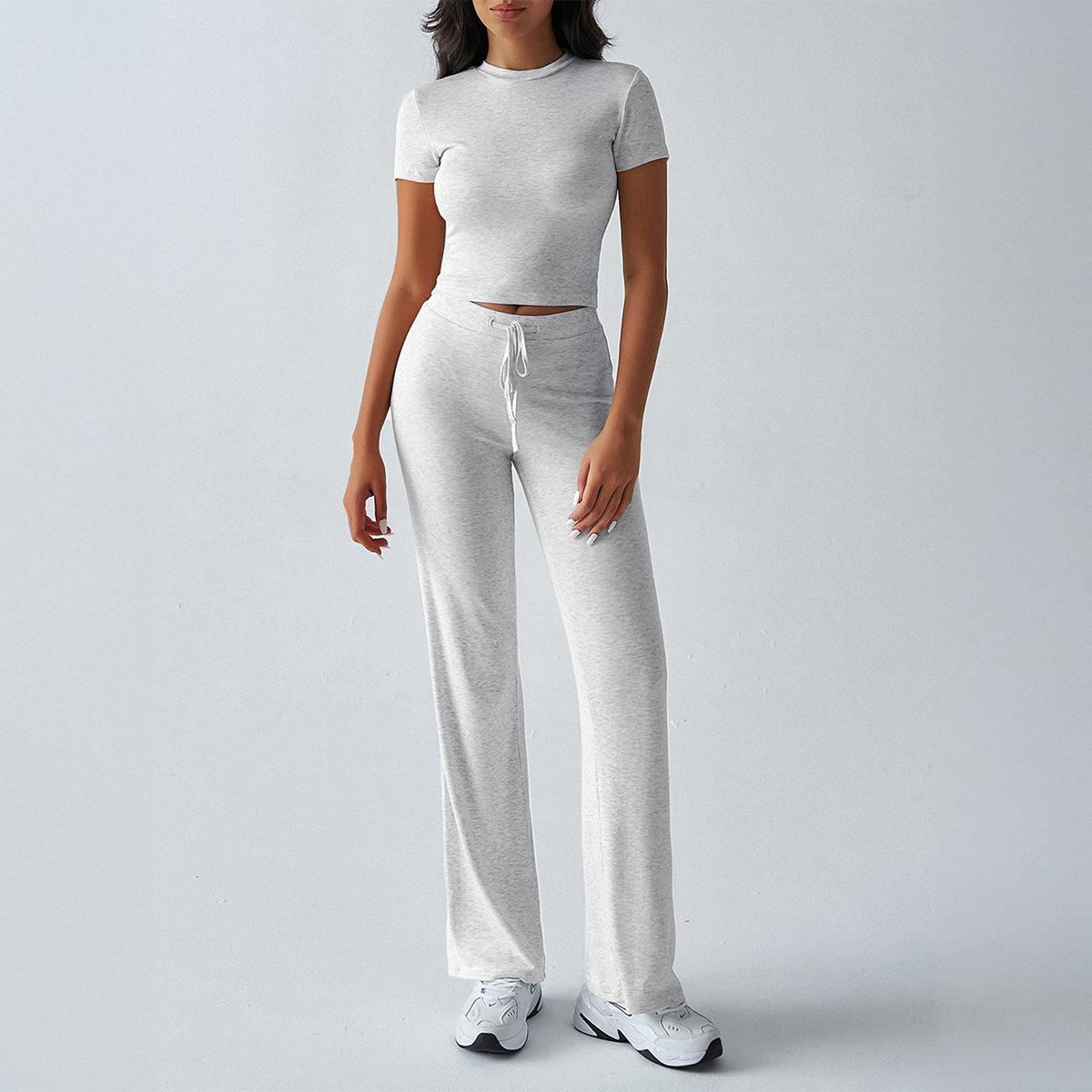 

Женский весенне-летний темпераментный отпускной удобный универсальный повседневный однотонный облегающий комплект с короткими рукавами и длинными брюками XL