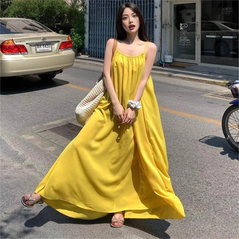 Seaside vacation sexy backless suspender dress women's summer new loose a-word skirt gentle yellow long skirt
