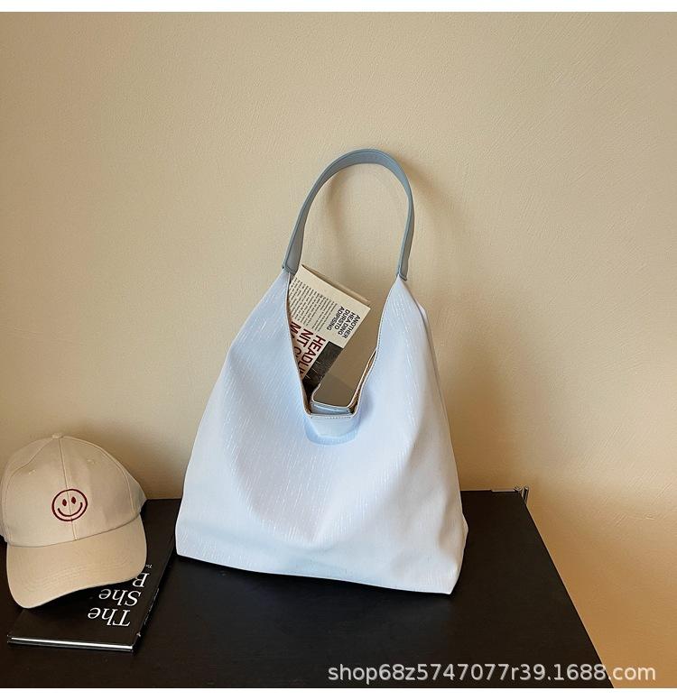

Tote bag women s new Korean version of fashion casual armpit bag 2025 trendy new large-capacity commuter shoulder mother and child bag синий