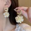 French Retro Metal Petal Dangle Earrings: Elegant, Unique Luxury Design.