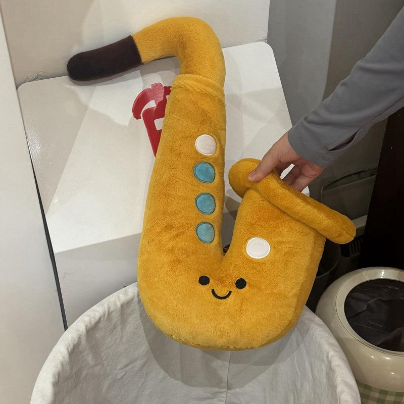

Saxophone musical instrument doll throw pillow plush toy college of music commemorative gift art student 20Cm pendant [0.1kg] жёлтый