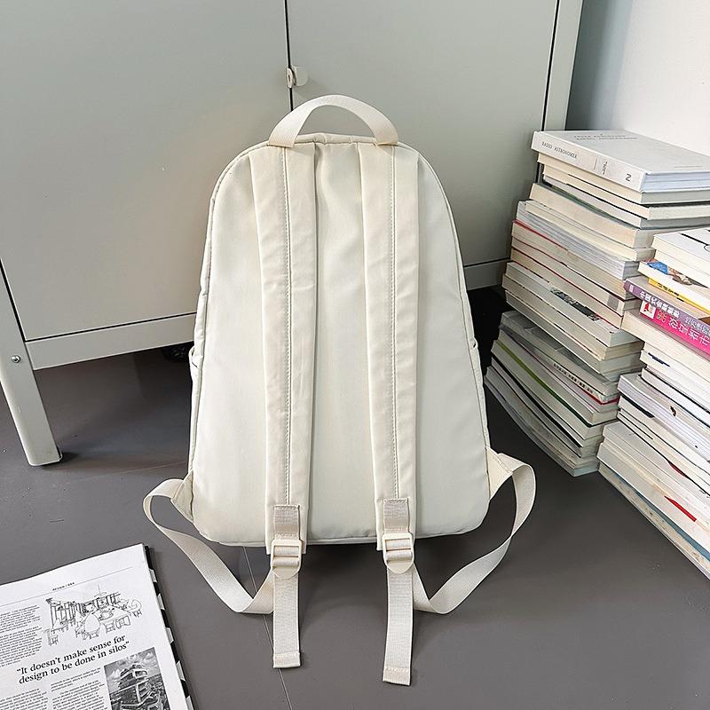 Solid color high-end backpack junior high school students casual simple travel large-capacity backpack