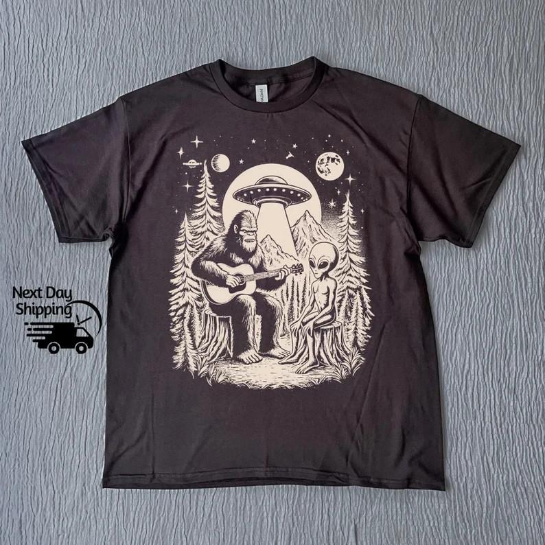 

Bigfoot Playing Guitar With Alien And UFO Vintage 90s T Shirt Full Size S3XL Unisex T-Shirt S