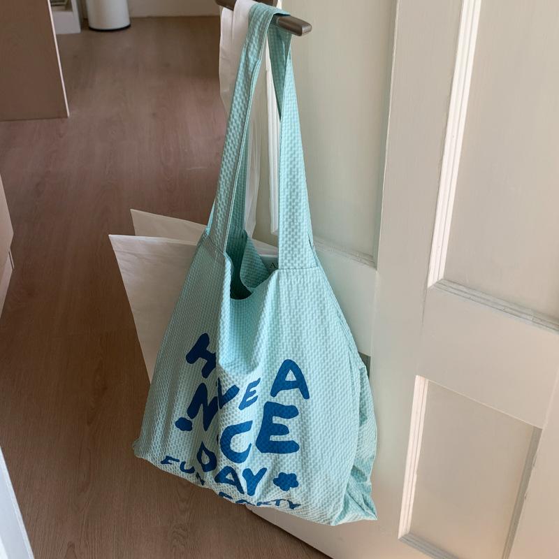 

Korean lazy shopping bag 2025 summer thin and light large-capacity cloth bag literary fashion letterprint tote bag синій