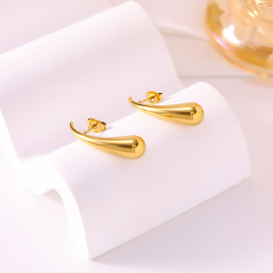 Golden Teardrop Titanium Steel Earrings: Elegant, Light Luxury for Women, Versatile Fashion Statement, Simple and Stylish Ear Cuff.