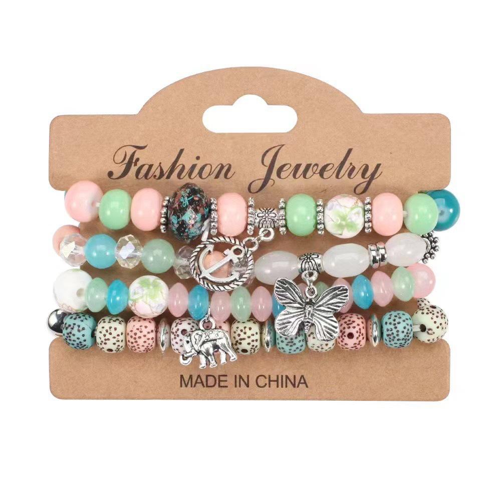 Bohemian Layered Bracelet with Elephant, Butterfly, and Anchor Charms