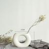 White Ceramic Vase with Dried Baby's Breath for Living Room or Dining Table Decoration