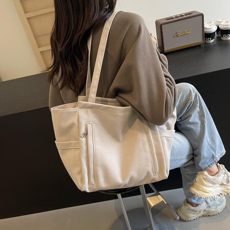 New large-capacity versatile handbag 2025 spring and summer popular lightweight shoulder bag simple tote hand carry big bag women