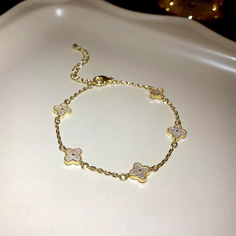 Gold Electroplated Four-Petal Flower Bracelet - Light Luxury, Sweet, High-End Hand Jewelry for Women