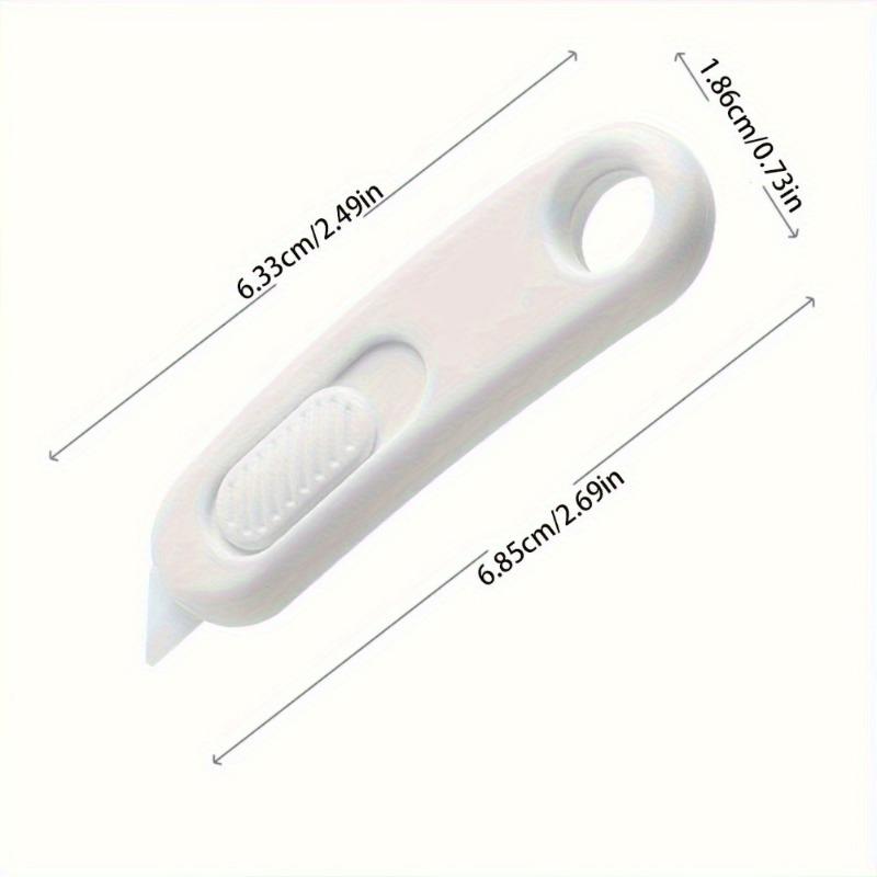 A small envelope and parcel scissors, designed for safety and concealment, perfect for opening envelopes and parcels