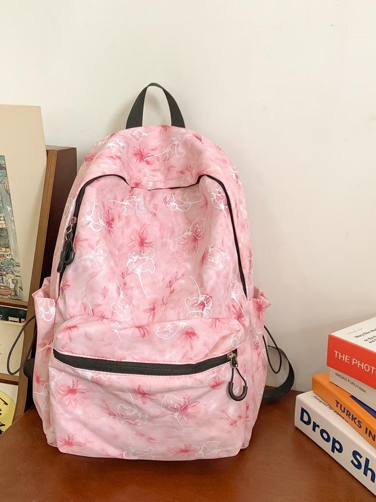 

2025 лето новый тренд принт мода простой текстуры повседневный личность иностранный стиль однотонный плечевой рюкзак розовый