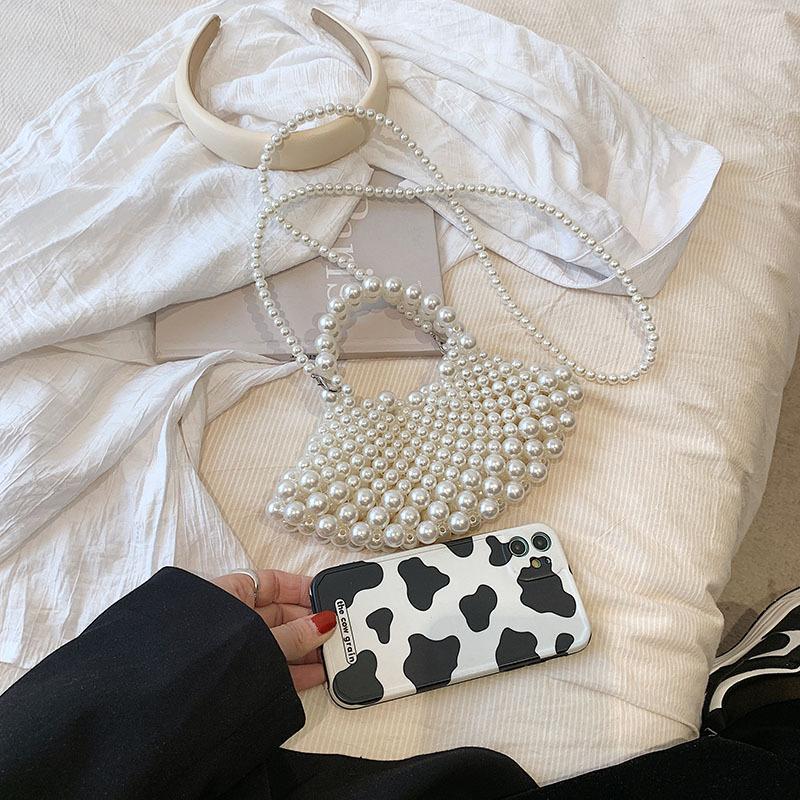 Bag summer new 2025 Mori foreign style Internet celebrity pearl woven bag ins wind one shoulder oblique fairy beach bag