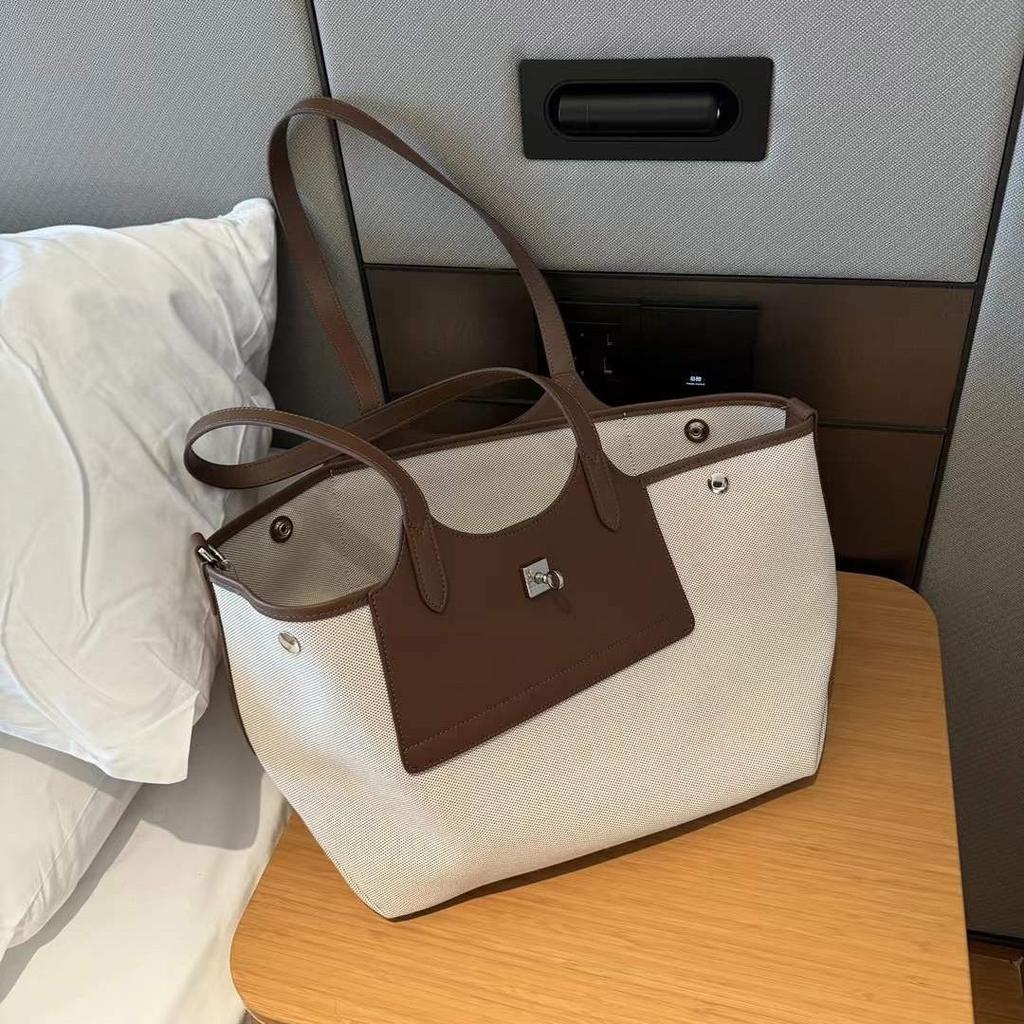 Niche Canvas Cowhide Tote Bag Large Capacity Wing Bun Mother Bag Casual Armpit Bag Women's Shoulder Bag