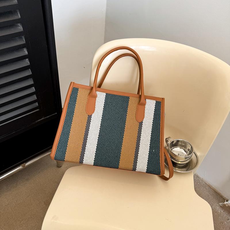 

Commuter contrasting striped handbag bag women s fashion messenger bag new women s versatile bag