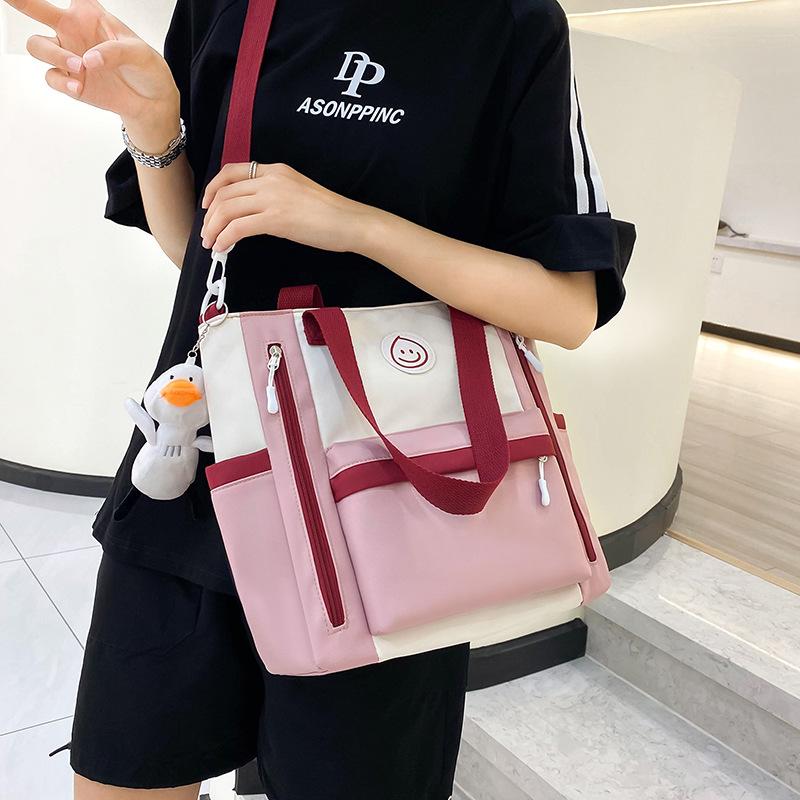 Contrasting color leisure large-capacity tutoring bag, junior and high school students book bag, hand bag in class, high-value messenger bag for women