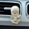 Creative car skull ornaments with the design of "see no evil, hear no evil, speak no evil", which are car interior decorations.