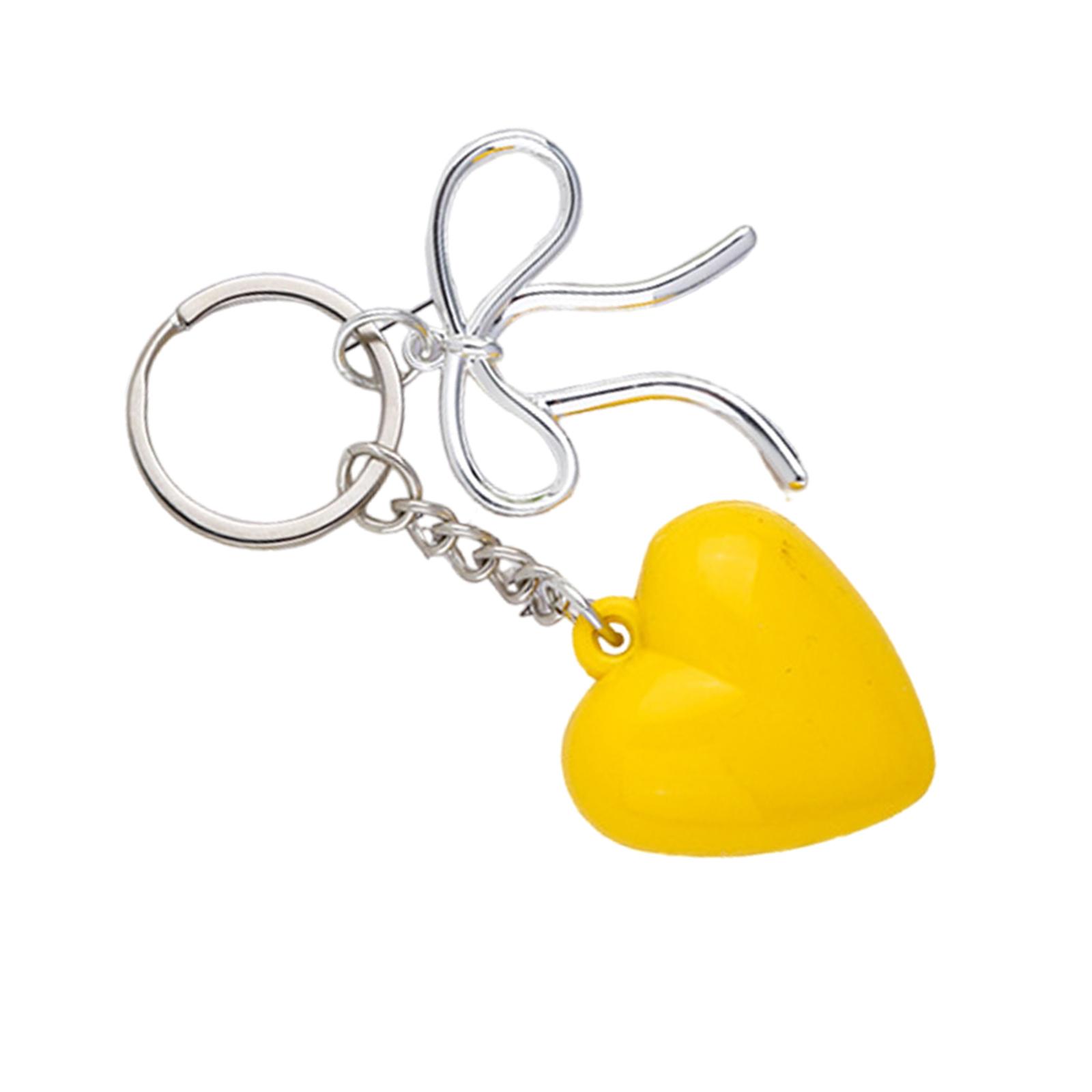 Элегантный брелок в форме сердца с бантом — фото 4