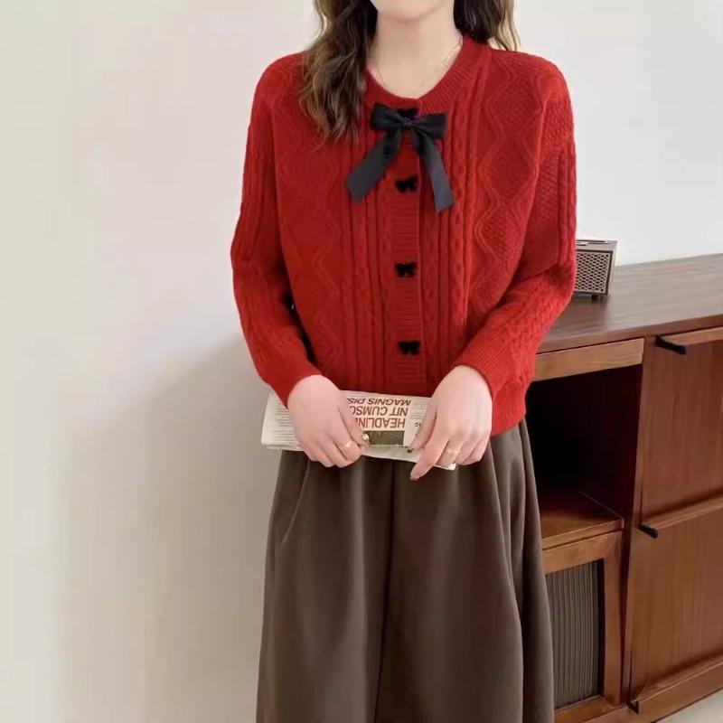Solid color knitted cardigan women's new autumn and winter bow button with twist sweater jacket