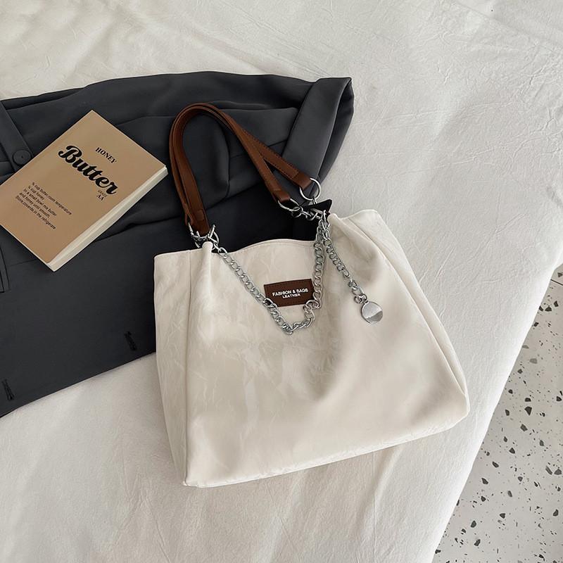 

Fashionable Black Pink Beige Tote Bag With Unique Design Ideal For Students And Commuting вершковий
