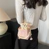 Summer solid color 2025 new personalized pumping belt foreign leisure sense simple pearl crossbody portable bucket women's bag small