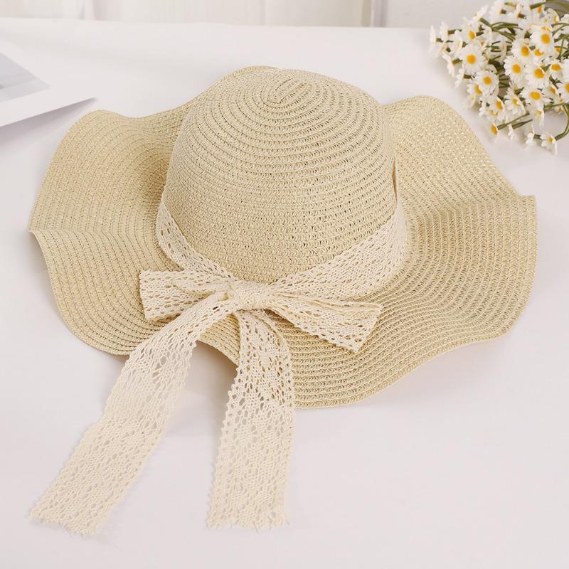 Summer wavy edge bow streamer straw hat seaside outing idyllic sunshade sun protection UV protection sun hat