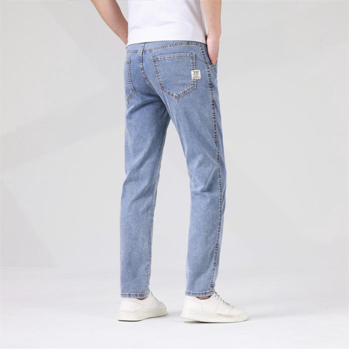 

2024 Весна и осень Новые высококачественные джинсы мужские модные свободные и универсальные брюки с короткими штанинами эластичные вышитые тонкие длинные брюки 36