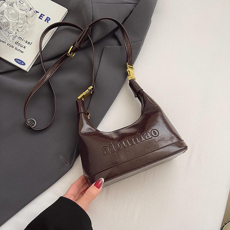 Trendy New Korean High-grade Texture Oil Wax Leather Hand-carried Dumpling Bag Temperament Versatile Commuter Women's Messenger Bag