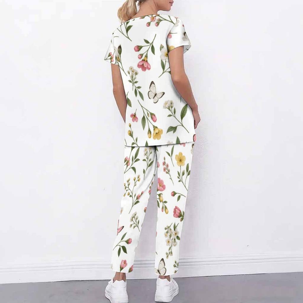 Women Plus Size White Floral Printed Scrub Set Cutout Neck Short Sleeve Pocket Top Long Pants