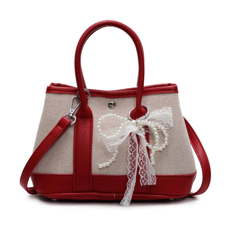 Wholesale Korean version of casual niche contrasting color portable bucket bag commuting versatile simple personality messenger women's bag